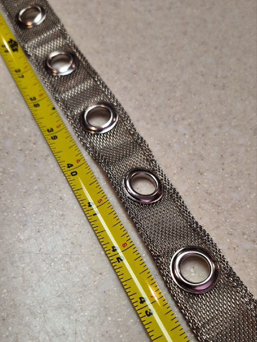 silver-toned metallic belt features a mesh chain construction - Picture 3 of 4